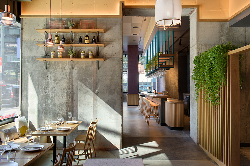 rockwell group designs library-like murray's cheese shop & cheese bar in long island