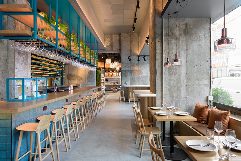 rockwell group designs library-like murray's cheese shop & cheese bar in long island