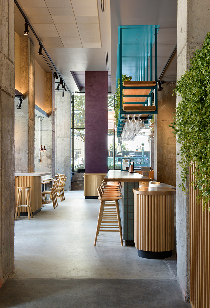 rockwell group designs library-like murray's cheese shop & cheese bar in long island