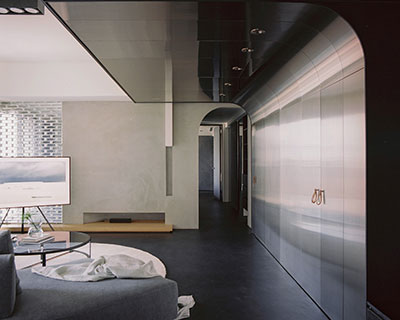stainless steel wall reflects daily life within minimalist interior by studioX4 in taipei