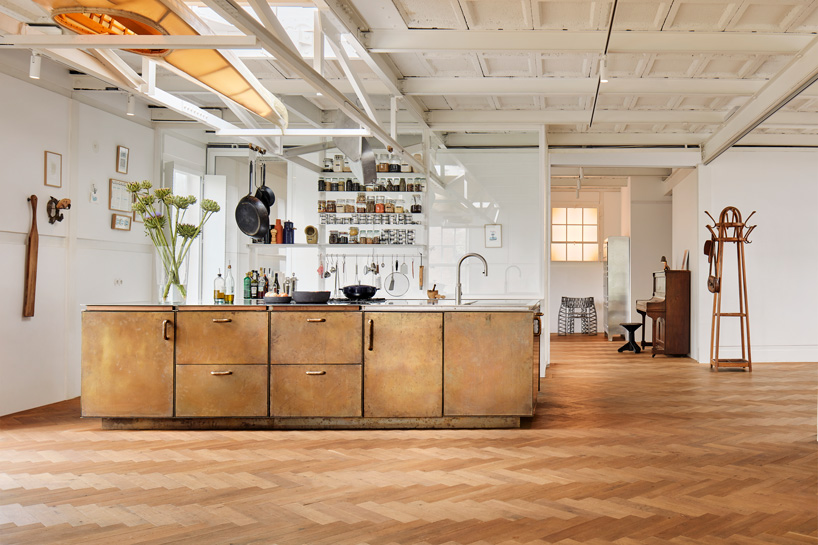 studio modijefsky has built a brass kitchen island