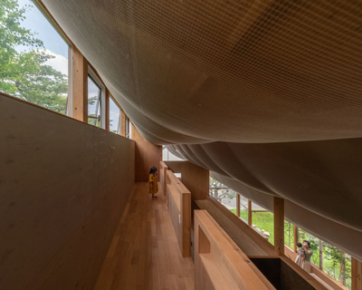 takayuki suzuki architecture atelier drapes sheer fabric across the ceiling of japanese house