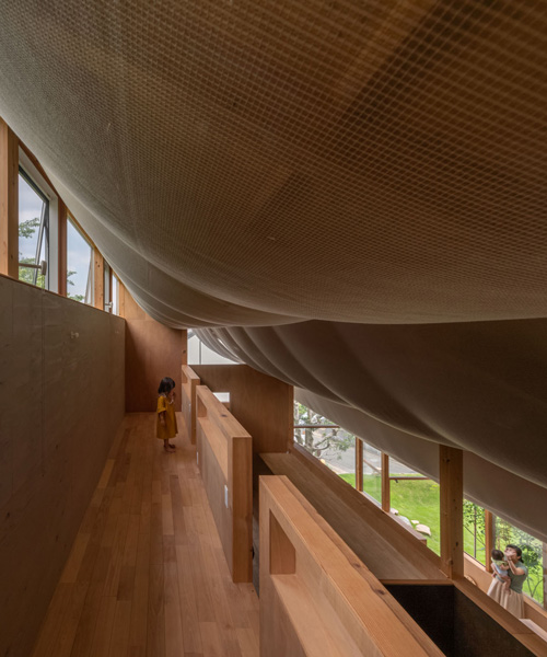 takayuki suzuki architecture atelier drapes sheer fabric across the ceiling of japanese house