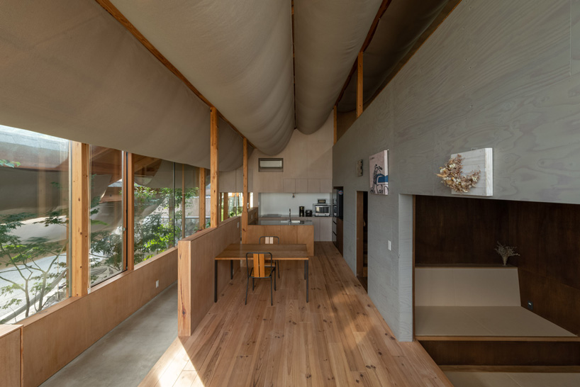 takayuki suzuki architecture atelier drapes sheer fabric across the ...