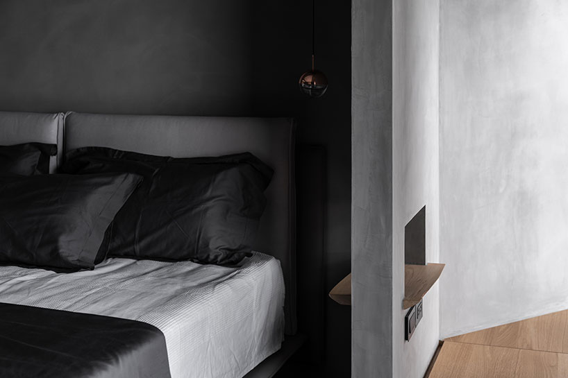 stainless steel wall reflects daily life within minimalist interior by studioX4 in taipei