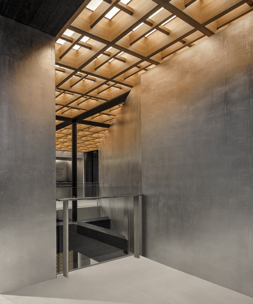 metallic surfaces + charred timber details form the vanke nantou gallery in shenzhen