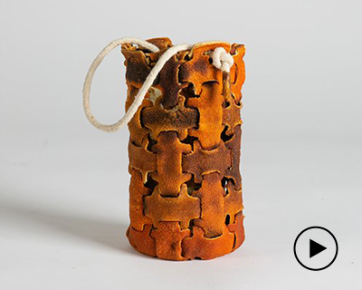 yuli meroz cuts, folds and knits orange peels to create intricate crafts