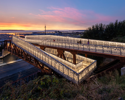 LMN architects curates luminous bridge with delicate perforations in everett, washington