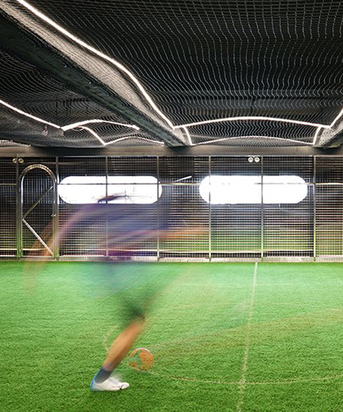 absence from island + studio etain ho turn a factory unit into a soccer pitch in hong kong