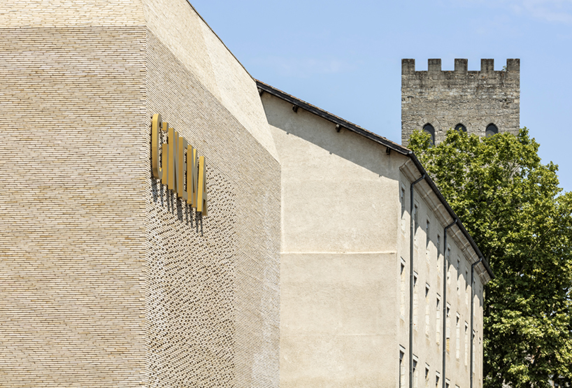 antonio virga architecte completes luminous, perforated cinema in cahors, france