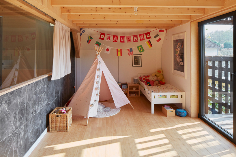 arba is building a wooden house between two old stone walls in rural france