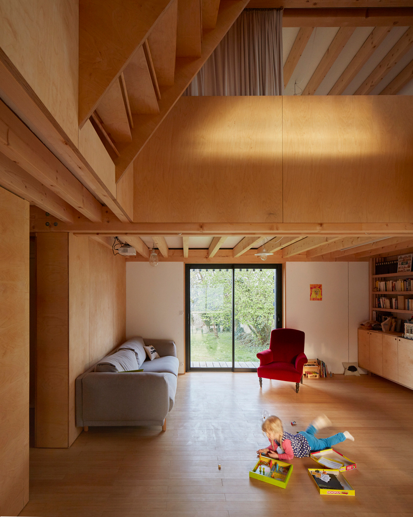 arba is building a wooden house between two old stone walls in rural france