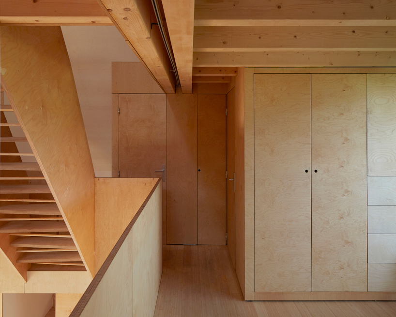 arba is building a wooden house between two old stone walls in rural france