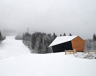 studio beltrame revisits traditional chalet architecture with ski school in italy