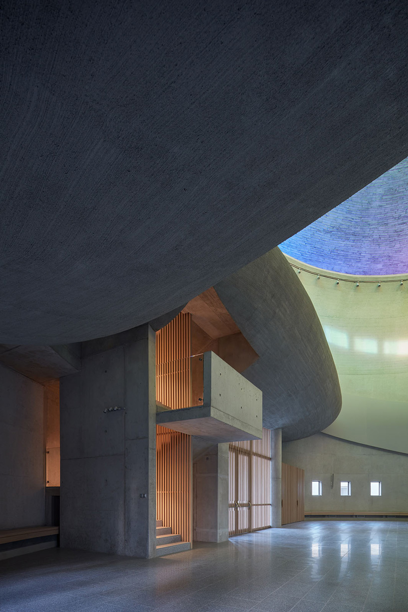 panoramic rainbow window tops atelier štepán's circular church in the czech republic