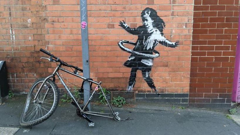 a suspected-banksy with a hula-hooping girl appears nottingham