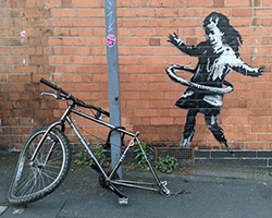 a new banksy with a hula-hooping girl appears in nottingham