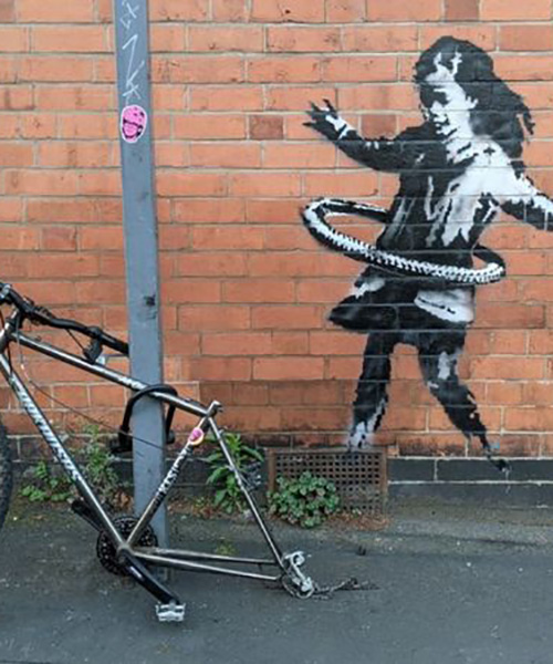 a new banksy with a hula-hooping girl appears in nottingham