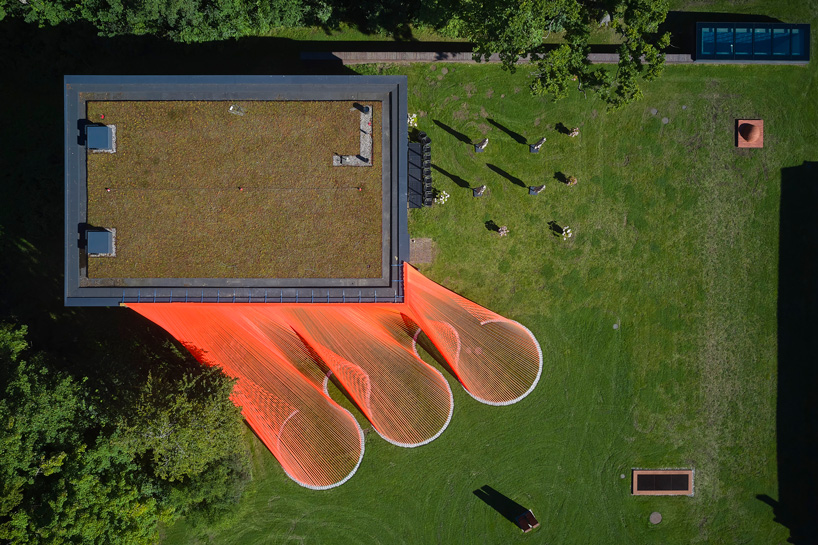 top view of behin ha's bright orange, mesh fabric installations in denmark