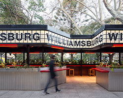billboard-like sign marks outdoor restaurant by hitzigmilitello arquitectos in argentina