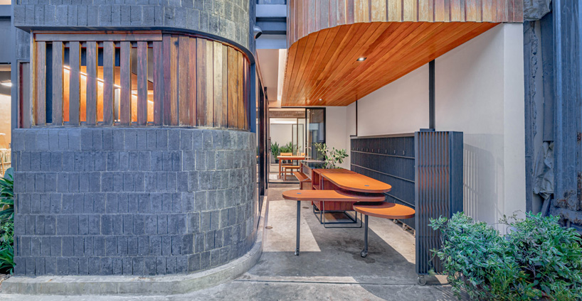 bodinchapa architects clads thai house + family business building in brick and wood façade