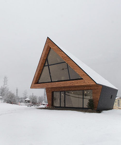 claudio beltrame revisits traditional chalet architecture with ski school in italy