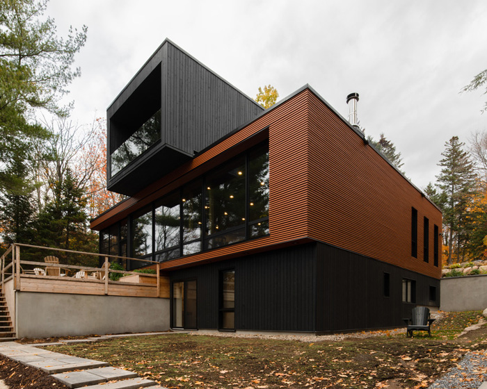 figurr architects collective stacks five prefab custom modules for house in québec, canada