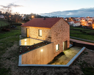 filipe pina adds an underground concrete patio to house restoration in portugal