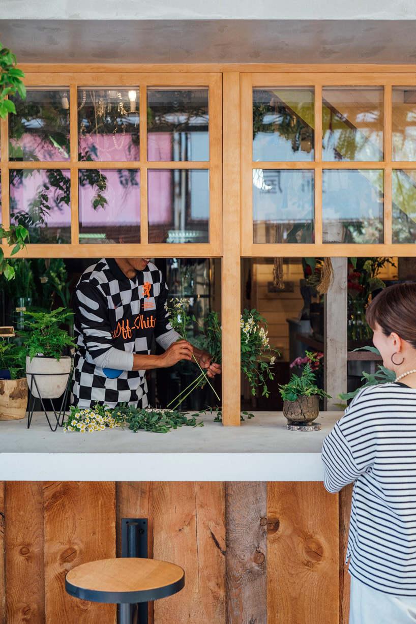 fathom completes the concrete façade of this japanese flower shop with ...