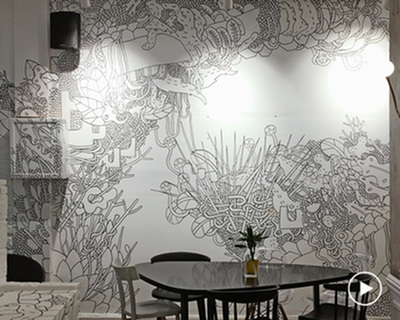 freehand monochrome mural by stefanos papadimos adorns solasta cafe's walls in athens