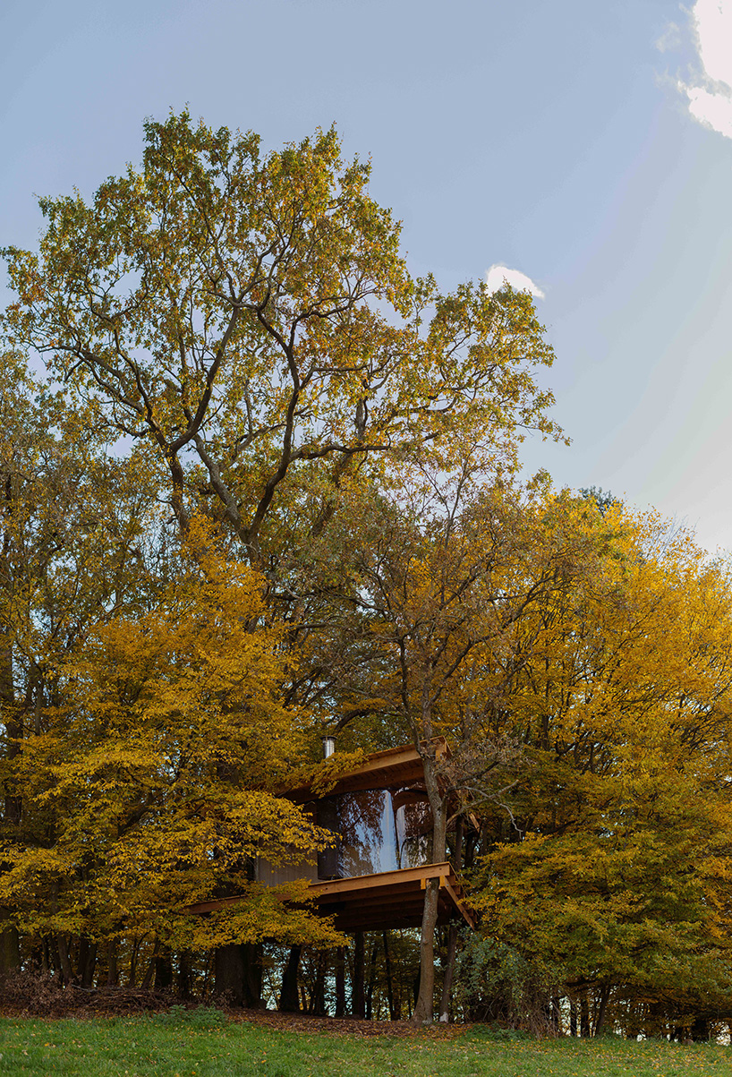 this treehouse by jan tyrpekl features a 360-degree view of nature