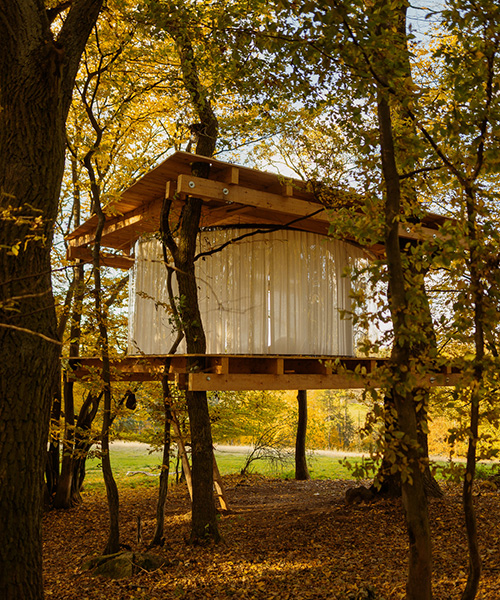 this treehouse by jan tyrpekl features a 360-degree view of prague's nature