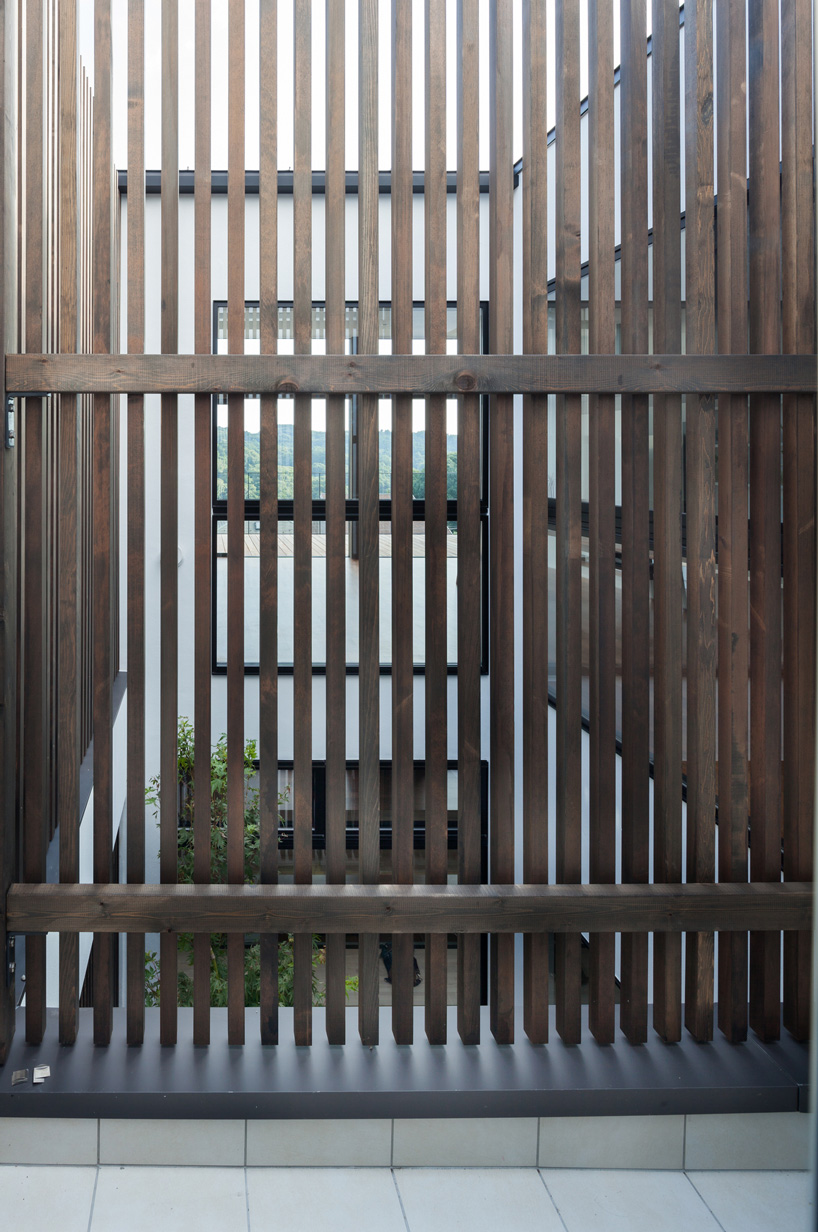 LEVEL architects conceals bright inner courtyard behind this house's blank façade in japan