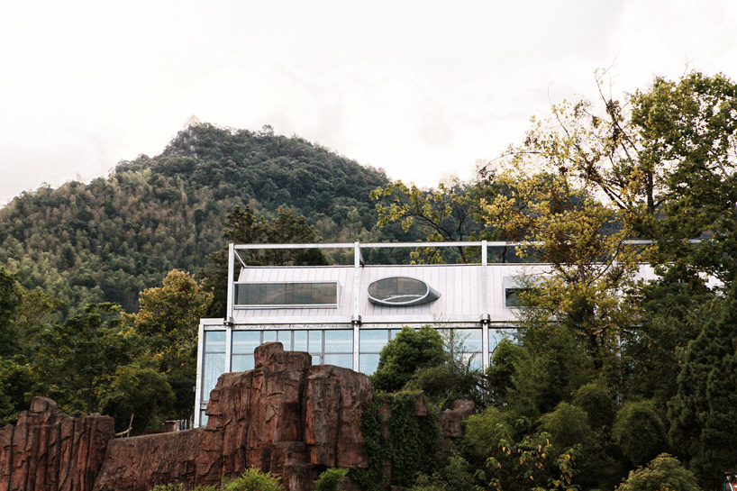 monolith architects transforms abandoned factory into 'ten times hotel' in rural china