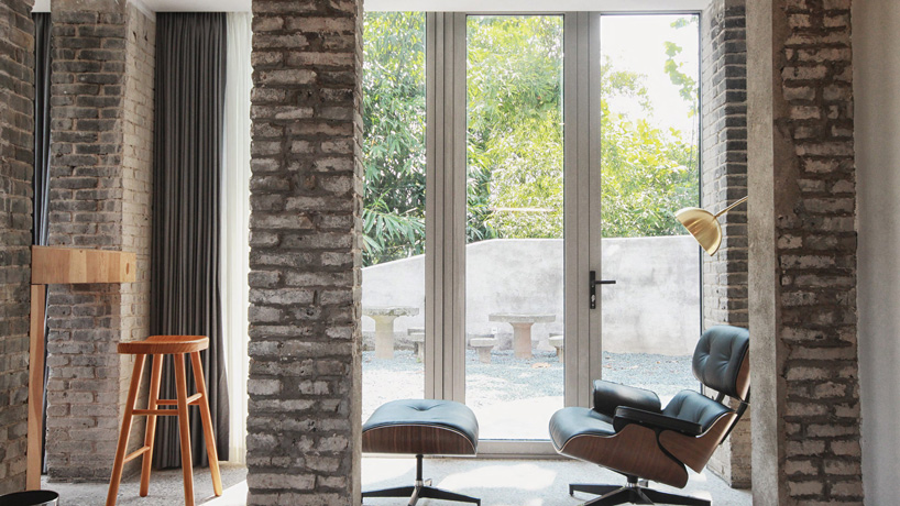 monolith architects transforms abandoned factory into 'ten times hotel' in rural china