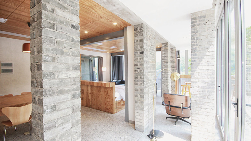 monolith architects transforms abandoned factory into 'ten times hotel' in rural china