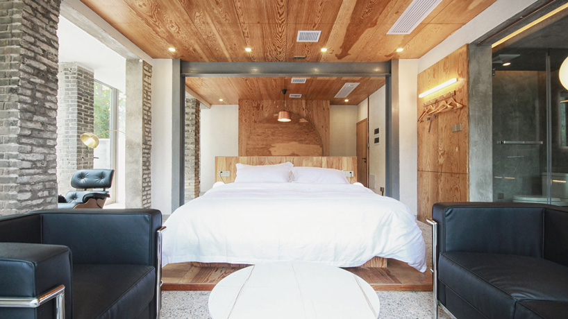 monolith architects transforms abandoned factory into 'ten times hotel' in rural china