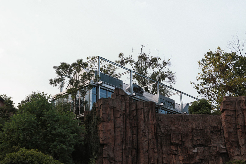 monolith architects transforms abandoned factory into 'ten times hotel' in rural china