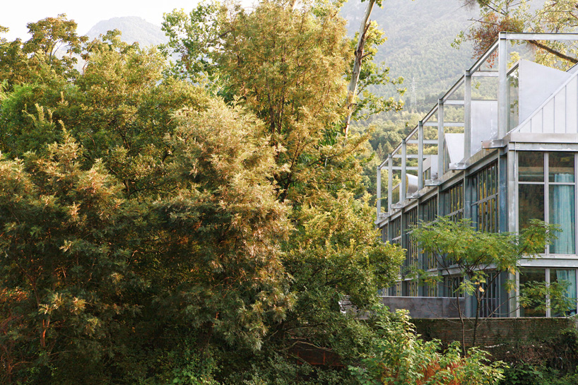monolith architects transforms abandoned factory into 'ten times hotel' in rural china