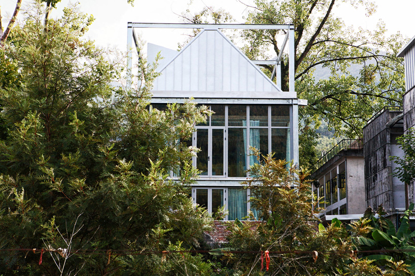 monolith architects transforms abandoned factory into 'ten times hotel' in rural china