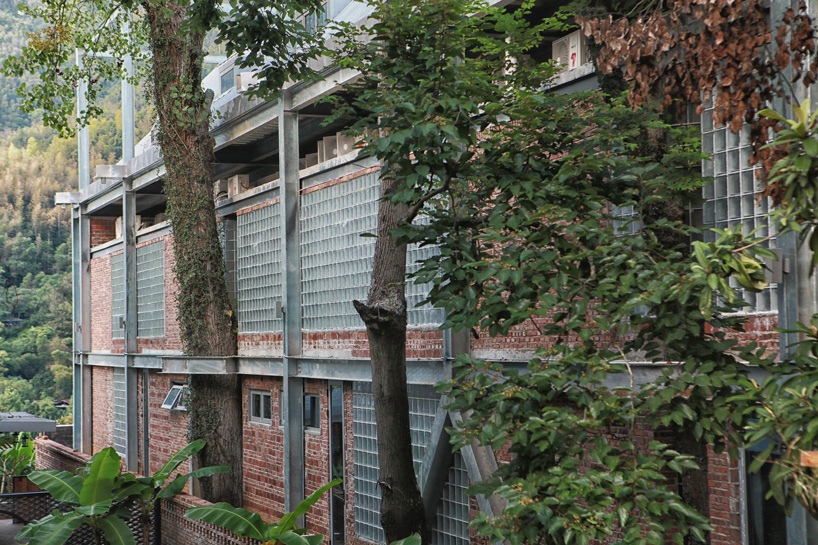 monolith architects transforms abandoned factory into 'ten times hotel' in rural china