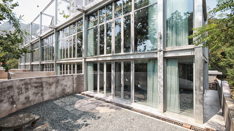 monolith architects transforms abandoned factory into 'ten times hotel' in rural china