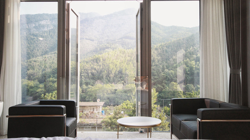 monolith architects transforms abandoned factory into 'ten times hotel' in rural china