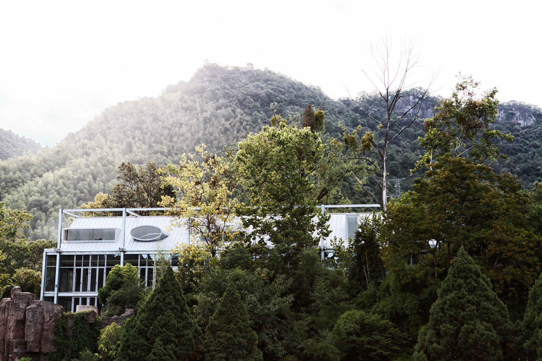 monolith architects transforms abandoned factory into 'ten times hotel' in rural china