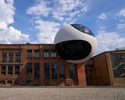 oscar niemeyer’s vision for a concrete and glass sphere is realized in leipzig, germany