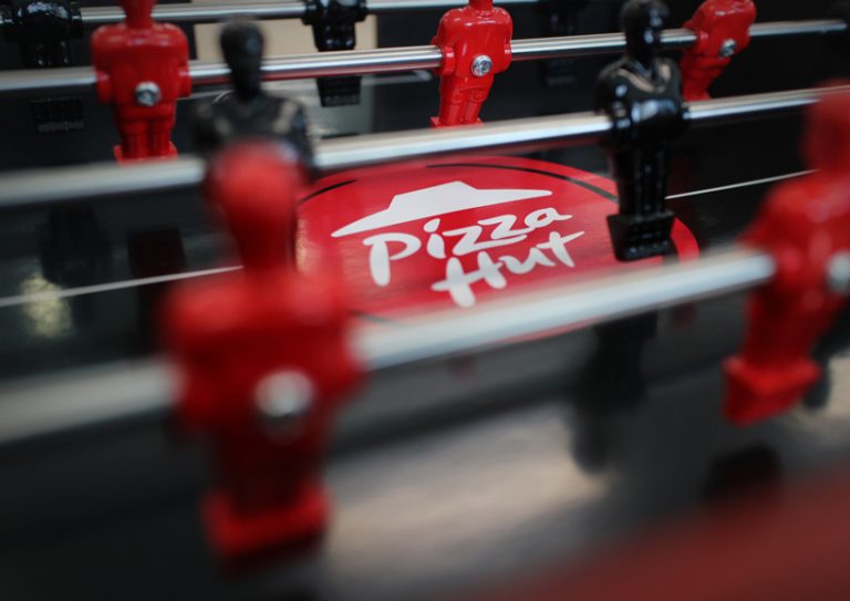 pizza hut + ogilvy unveil a pizza box with a foosball table in the lid