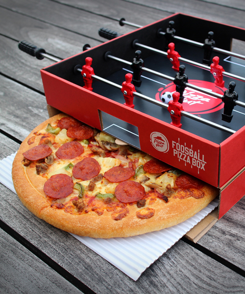 pizza hut + ogilvy create a pizza box with a foosball table in the lid