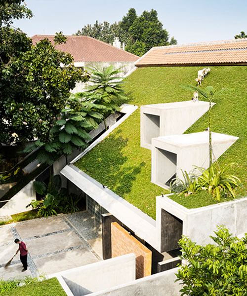 RAD+ar tops tropical residence in indonesia with green steep pitch roof