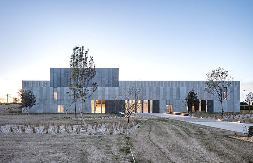 randja architects completes robust stone & concrete technology park in france