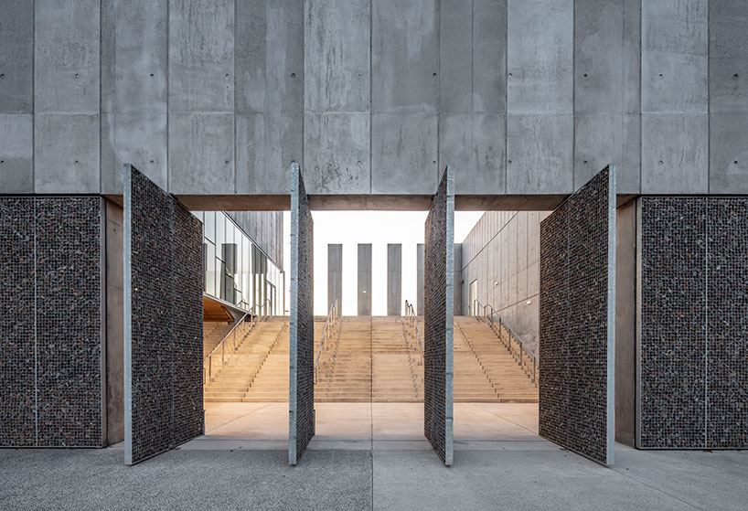 randja architects completes robust stone & concrete technology park in france